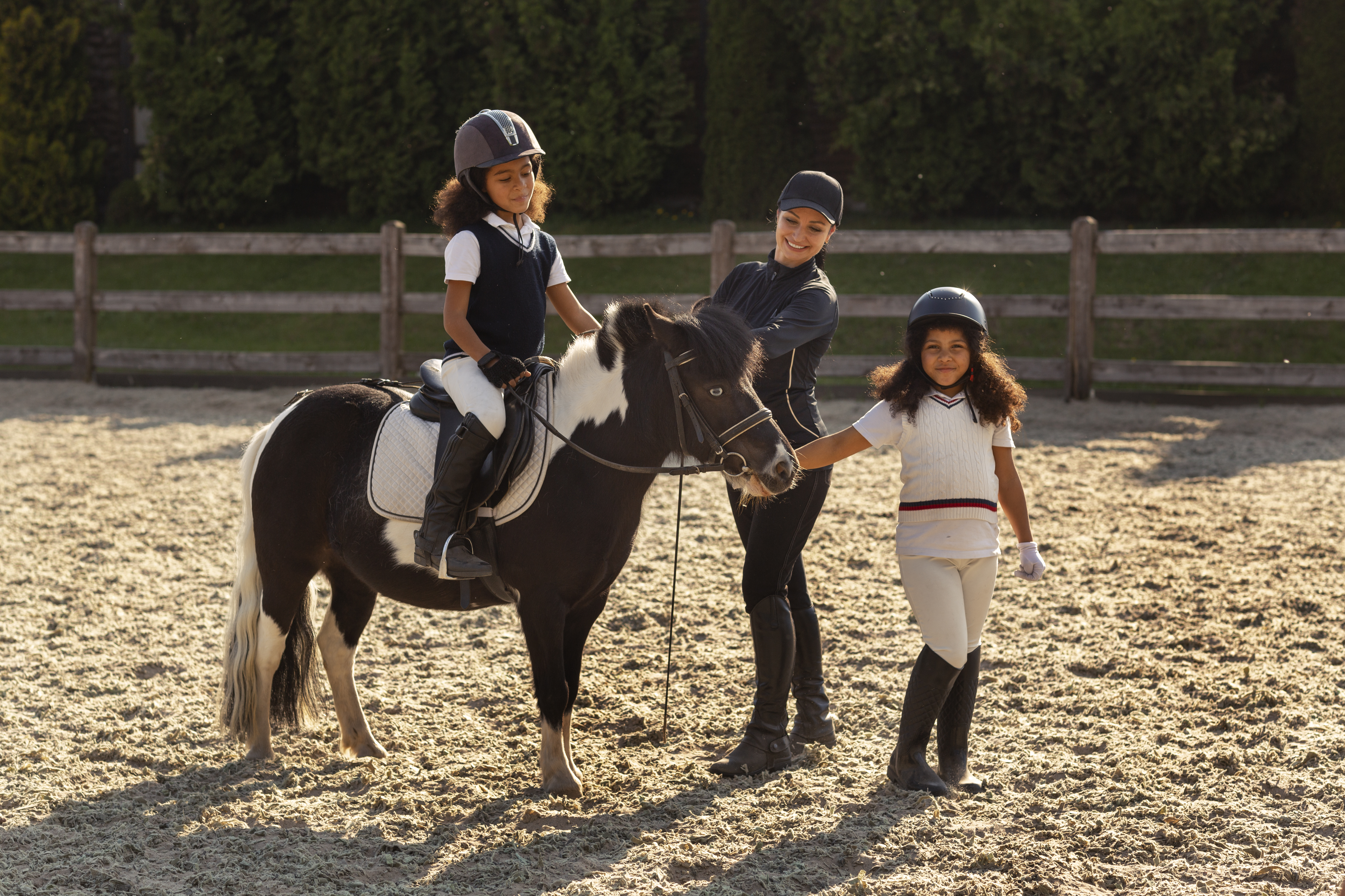 full-shot-children-learning-ride-horses